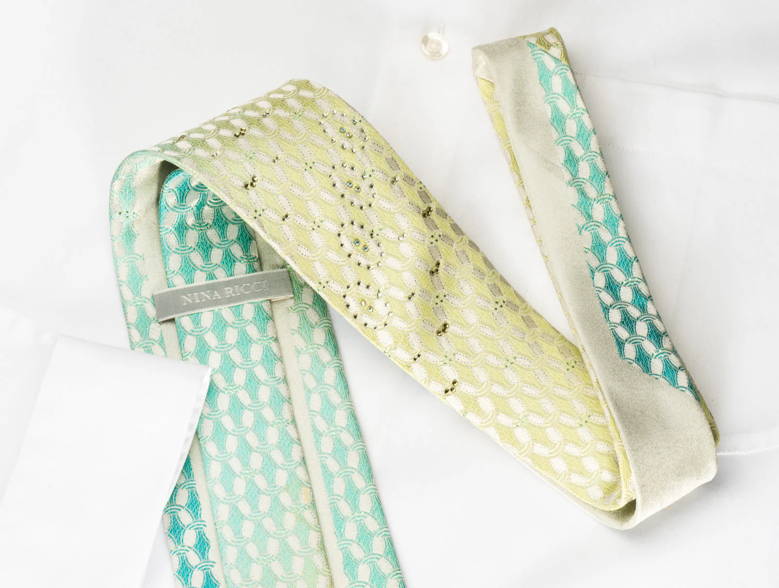 Nina Ricci Silk Rhinestone Necktie Green Turquoise Interlocking Ovals On White With Silver Sparkles - Image 4